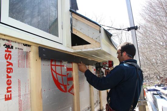 Pollard fastens Cor-A-Vent SV-3 corrugated plastic vent channel material under the spacer, leaving a ?-inch gap for air to flow through the Cor-A-Vent from the rain screen cavity. This will allow air behind the siding to exhaust to the outside.