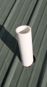 On the outside, the result is a common and easy pipe penetration through the exposed-fastener metal roof. 