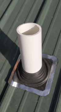 The author then installs a flexible boot (this one is made by Oatey), which has a soft aluminum and lead edge made to conform to the panel ribs (13). (For more on the installation of this type of boot, see the author’s article “Reroofing With Exposed-Fastener Metal Panels,” Sep/20.)