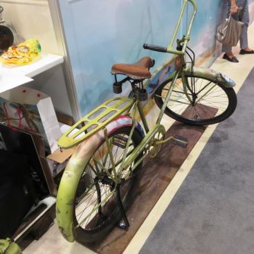 What’s this old bicycle doing here? It was behind the booth of a company that sells airbrushing supplies and had been done up in a WWII theme that included fighter planes, bombers, and a pair of attractive WACs…