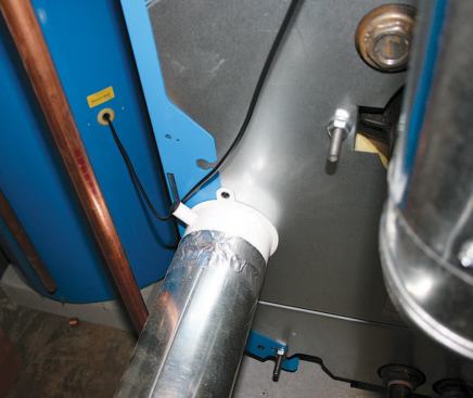 A 4-inch-diameter rigid duct delivers combustion air to the rear of the boiler.