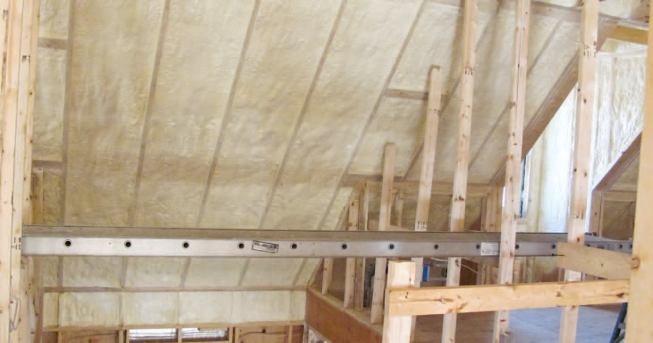 Sloped ceiling rafter bays were fully baffled with 2-inch foam board, then filled with closed-cell foam.