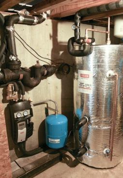 A pressure tank and insulated storage tank complete the installation.
