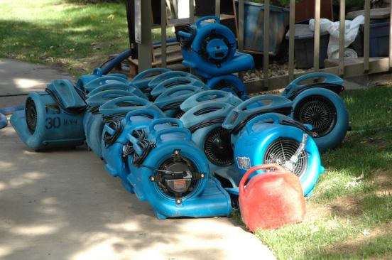 These snail-shaped air movers are called carpet driers because their wide flat outlet can be tucked under carpeting.