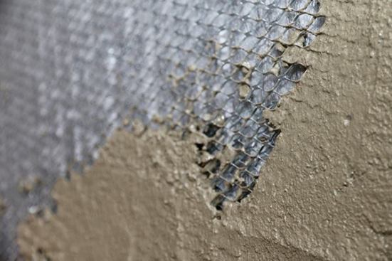 Also, you’ll notice that we are NOT using a layer of felt behind the stucco. The felt behind stucco is meant to be a bond breaker, meaning the stucco scratch coat (1st coat) bonds to the felt paper and the WRB behind that won’t get clogged. In this case, the fabric on the Delta Dry Stucco & Stone is the bond breaker and keeps the scratch coat from filling the air space.