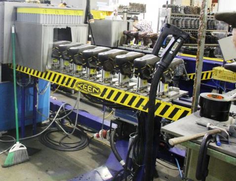 The lasts and uppers are placed on a conveyor and run through a “box” where they are heated with steam. This makes the uppers more pliable and allows the next guy in line to adjust the fit so they are tight to the lasts in all the right places