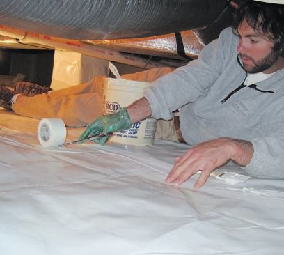 Fiberglass mesh tape followed by a thick coating of duct mastic created rugged, waterproof seams.