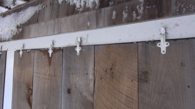 A closer look at the storm shutter hardware. This storm shutter protected the house during the storm, keeping water out of the first floor as homeowner Joe Hackett rode out the storm on site.