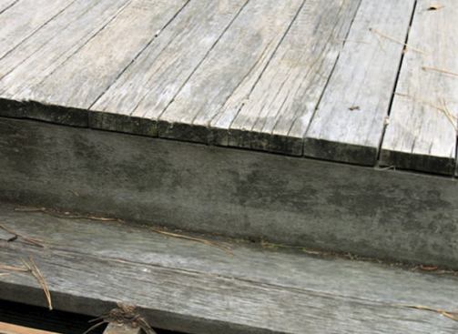 The surface of the 15-year-old deck was weathered and rough, and the nails were lifting out.