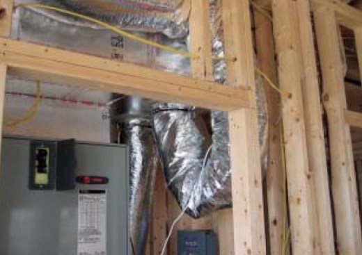 The kink in this duct will severely restrict airflow. Like a kink in a  hose, the reduced size increases the pressure in the duct, causing any leaks to  shoot air at a higher velocity.