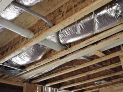 Coordinate the mechanical trades: This conflict between the HVAC  duct and a plumbing drain could have been avoided by both trades meeting  and reviewing the plans prior to the crews’ arrival on site.