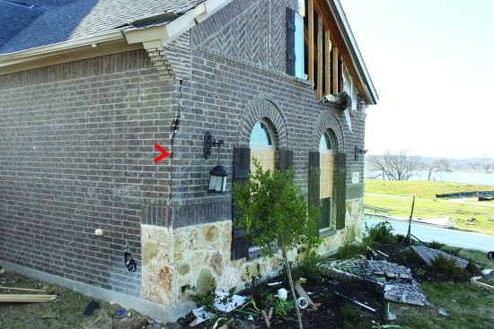 Vertical cracking in the brick at the corners of buildings was a typical failure—the result of lateral displacement, or “drift,” of stud walls built without sufficient bracing.