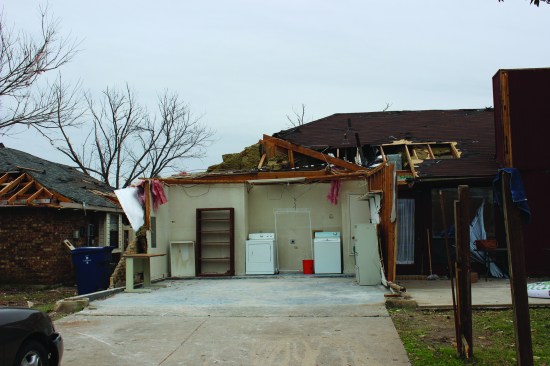 ... and caused the loss of roof sheathing in nearby areas of the main house roof.
