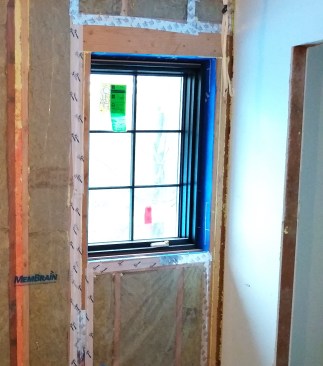 Keeping continuity of layers is important. In this case, the author’s WRB is Henry Blueskin, and the inside of the window is the connection point. The crew used a closed-cell polyethylene foam backer rod and a flexible sealant (Sashco Big Stretch and DAP Extreme Stretch) to connect the window to the WRB. They added the extension jambs during the finishing process. Keeping the extension jambs off until later allows the air barrier connection to be placed as close to the exterior as possible.  