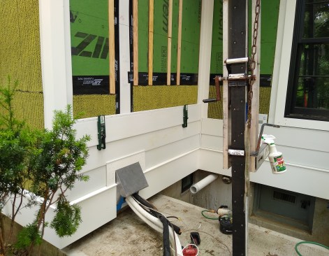 There is no caulk used between the siding elements and the window or door units. This reduces future maintenance. Water intrusion can drain and dry. The rainscreen is a combination of marine plywood strips and Benjamin Obdyke Slicker Rainscreen. The Slicker on the lower section inhibits bugs from getting into the air cavity behind the siding. The rainscreen is pressure balanced, allowing air to flow up from the bottom and into the soffit.