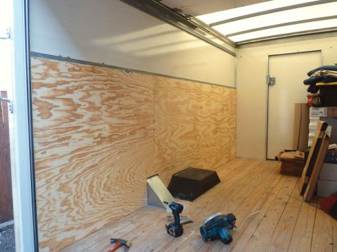 We attached a single layer of 5/8-inch AC plywood to the hat channel, which gave us a solid surface for attaching our storage casework.