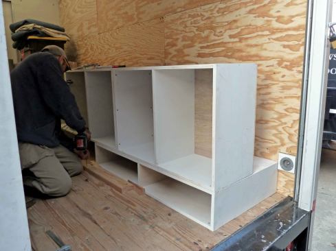 The drawer bases on the passenger side are 24 inches deep, but the storage carcasses on top are just 13 inches deep.