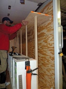 We completed the sheet-goods rack with a shelf that sits 50 inches above the drawer base supported by a cleat on the wall of the truck box and vertical strips attached to the backs of the storage cases.