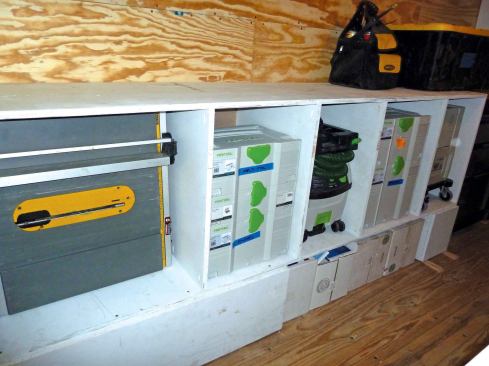 The carcasses on the driver's side—both the drawer bases and the storage cases—are 20 inches deep to permit storage of larger items, such as the compressor, shop vac, and table saw.