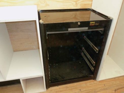 Next to the cabinets on the driver's side we left room for a metal mechanics toolbox. We took the wheels off the box and secured it to the truck box. The toolbox has drawers of varying depths, all of which are mounted on ball-bearing drawer glides.