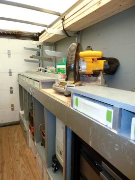 We built a miter-saw station above the cabinets on the driver's side. Having the saw inside the truck allows us to do our cutting in a sheltered area out of the weather and keeps dust in the truck, minimizing cleanup as well as disruption to our clients' homes.