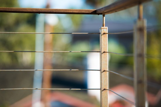 Though less than a year old, the existing T304 stainless steel railing was starting to corrode because of its proximity to the beach.