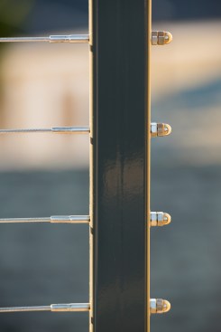 The replacement posts were fabricated from T316 marine-grade stainless steel 2-inch tube with a powder-coat finish.
