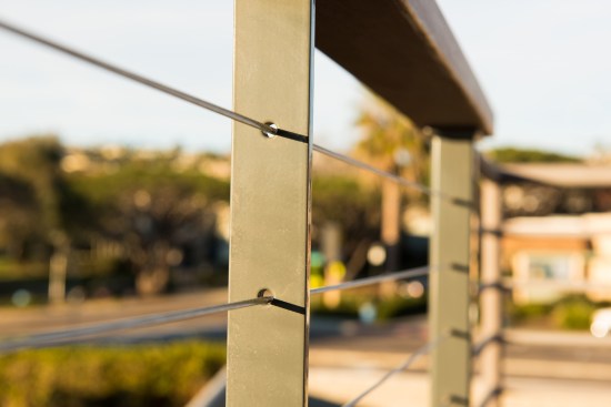 Solid 11⁄2-inch-by-3⁄8-inch flat bar was used for the intermediate posts.