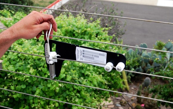 A tension gauge is used to indicate when the cable is tight enough, typically at 150 to 200 lb. of tension.