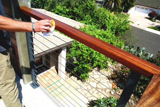 Routine cleaning and maintenance with a penetrating oil finish is needed to keep the ipe top rail looking good in a marine environment.