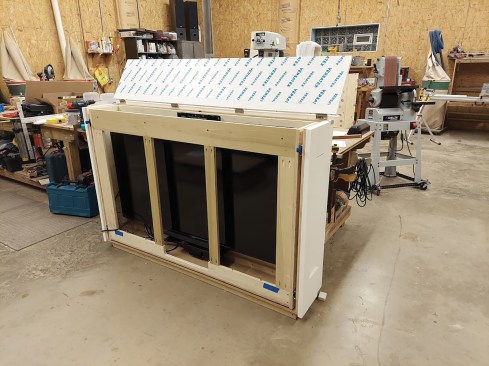 If the TV needs to be able to rotate, the lift can be installed in a cabinet with a pull-out drawer mounted with heavy-duty slides that allow the whole assembly to extend out away from the wall.