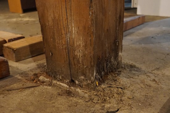 The existing footing was sound; only rot at the base of a post was of structural concern