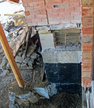 Final steps. There is still an enormous amount of site work to complete, and the utilities must be connected. We now have retaining walls all along the site perimeter and have begun the task of hauling recycled concrete fill, over which I'll lay top soil.