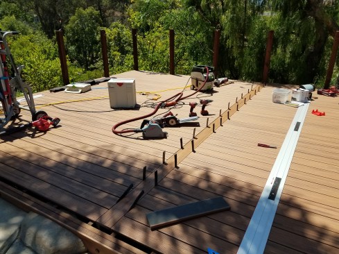 Installing a seam board in the middle of the 28-foot-wide deck avoided the need for butt joints in the decking.