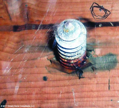 Water intrusion is causing wood rot and the red rust on this lag bolt; the connection is likely weakened.