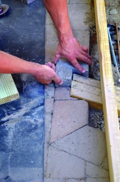 The beam had to be carefully cut into the stone patio rather than rested on it.