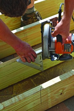 Workers then cut the joists to length with a circular saw, finishing the cuts with a recip saw where space was tight.