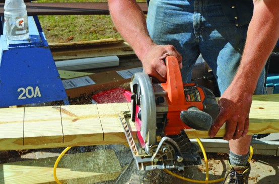 The band joist was framed with a pressure-treated 2x8 that was kerfed to allow it to bend and follow the curve of the deck.