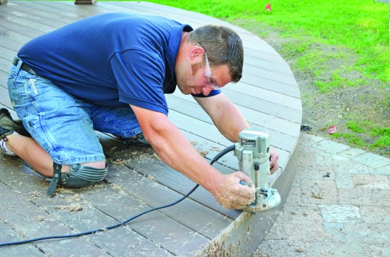 Next, he smoothed the edge with a router equipped with a flush-cut bearing bit.