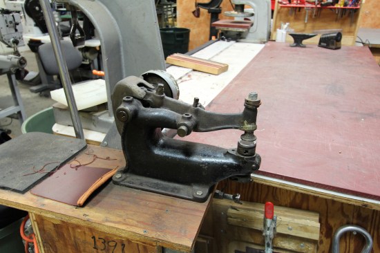 This is the area where Thurner makes prototypes. The ancient machine in the foreground drives a "hammer" against an "anvil" and is used to crease folded material prior to stitching.Thurner doesn't do market research in the usual sense--he designs products based on what he thinks tradesmen will like and find useful.