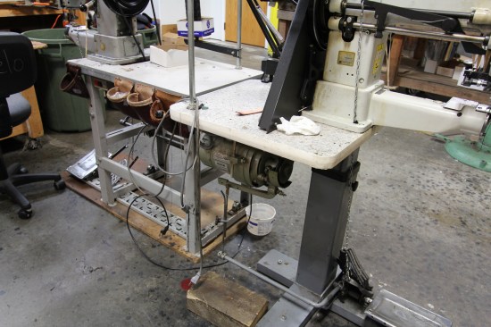 It takes a powerful motor to drive a needle through multiple layers of leather. The large motor on this machine has a clutch, which fills half the space in the housing.
