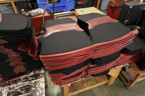 These pieces will be folded and stitched into tool belt bags. The sides are foam sandwiched between layers of nylon; the top edges and bottom are clad in leather to prevent tools and fasteners from wearing through the material.