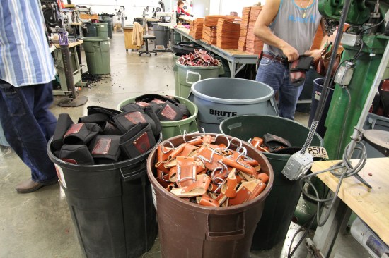 Bags and tool holders with hammer loops staged and ready to attach to tool belts.