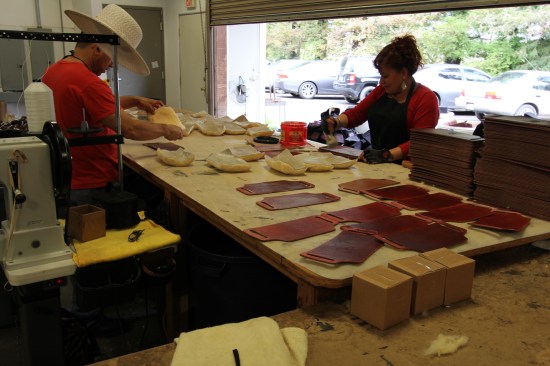Yep, that's lamb's wool fleece they are gluing to pieces of leather. But why?