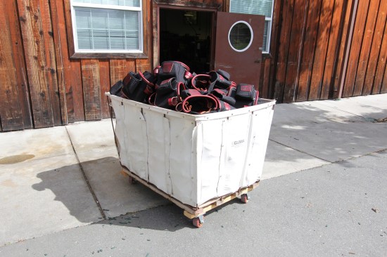 This is one of my favorite images from my tour of the factory--a laundry cart full of tool bags waiting to be sewn and riveted to belts.
