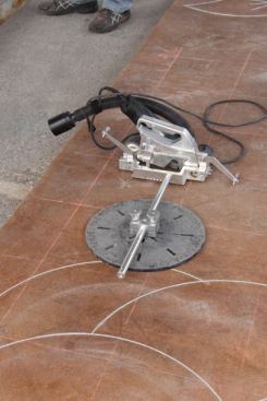 A 
Mongoose concrete engraver attached to a circle jig.