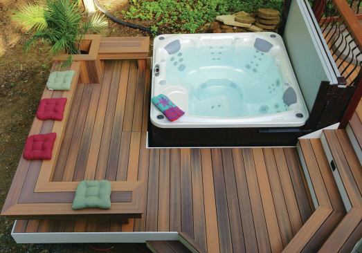 Most hot tubs are equipped with a cover that has an articulating arm to lift it; make sure to allow for enough room for the cover to fold up and out of the way.