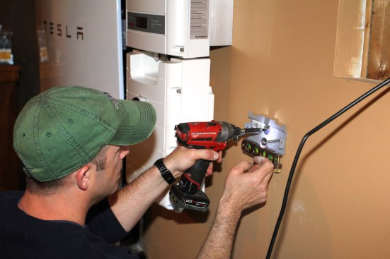 Mlllette fastens the transformer mounting plate in place.