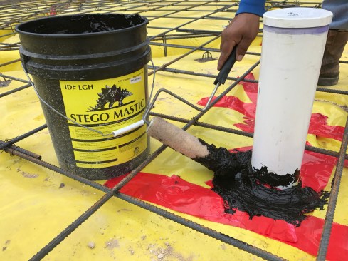 ... as well as a compatible mastic, which we used in addition to the tape to seal all the slab penetrations.