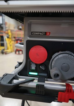 The large red paddle button to stop the saw is nice. To start the saw, you pull the red paddle out, then activate the main switch (gray button with white circle). To deactivate the brake cartridge (or put the saw in "bypass ") is required when cutting wet material, such as pressure-treated lumber, which the author's crew does frequently. To do this requires turning the bypass switch (to right of main power switch) while pulling the red paddle button out. The author would prefer a simple on-off switch for the safety system.